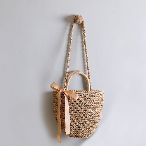 Basket bag with stylish carrying handles and decorative bow Bowlift