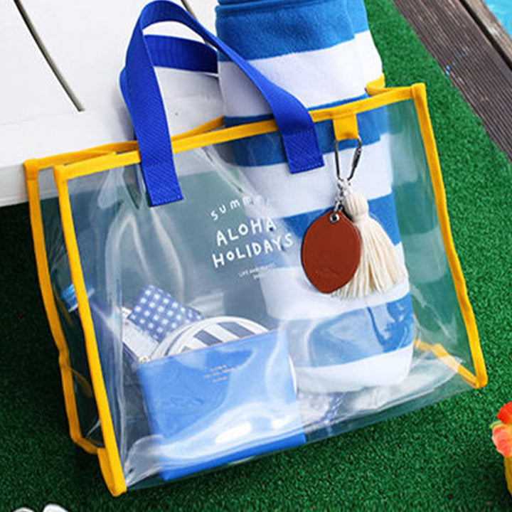 Transparent beach bag with sturdy carrying handles and various compartments Bowlift