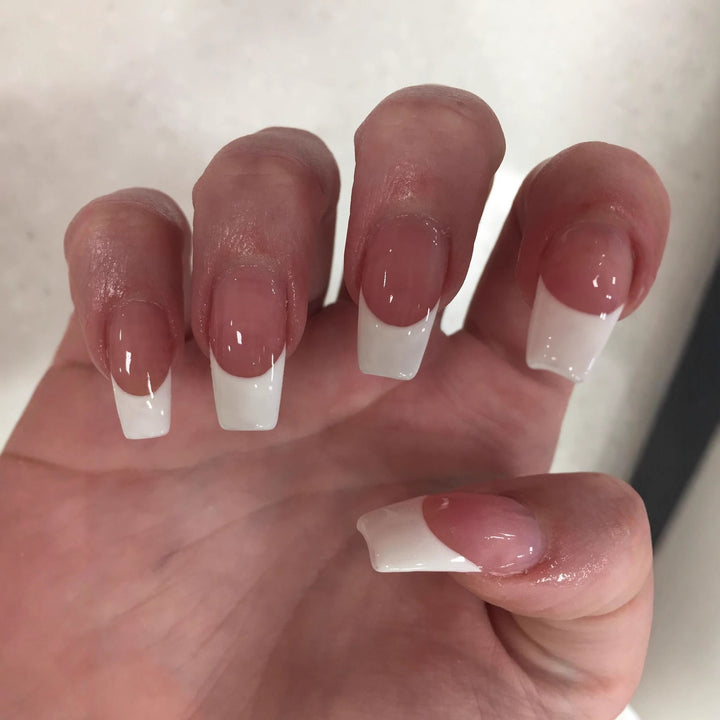 Artificial nails in elegant French Tip design Bowlift