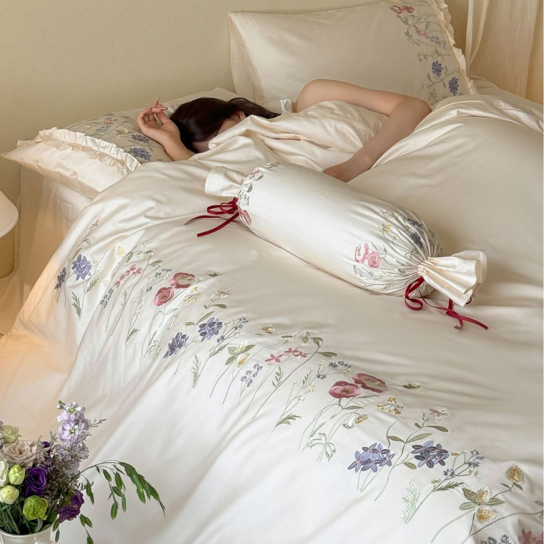 Fine satin bed linen set with delicate botanical embroidery and ruffled edge Bowlift