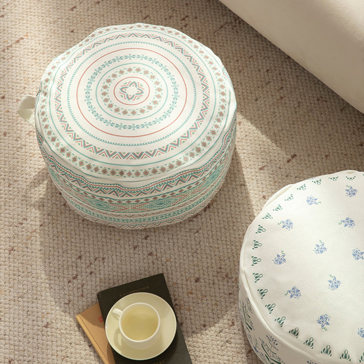 Round floor pouf with ethnic weaving pattern and practical carrying handle Bowlift