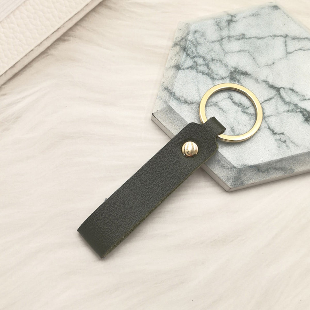 Unisex keychain made of high-quality synthetic leather with elegant metal embellishment Bowlift