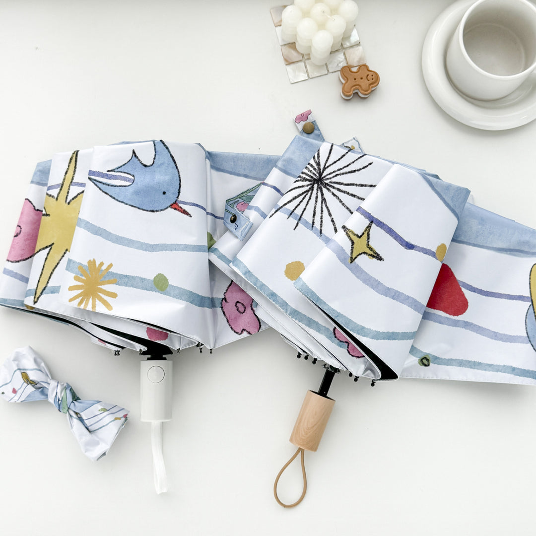 Women's Folding Umbrella with Playful Cartoon Design Bowlift