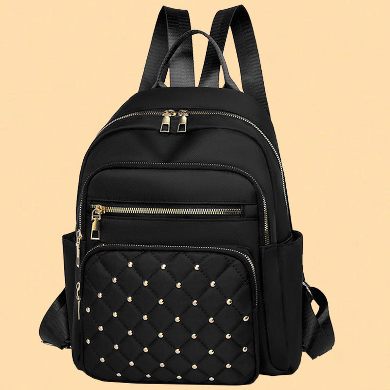 Women's Quilted Backpack with Decorative Studs Bowlift