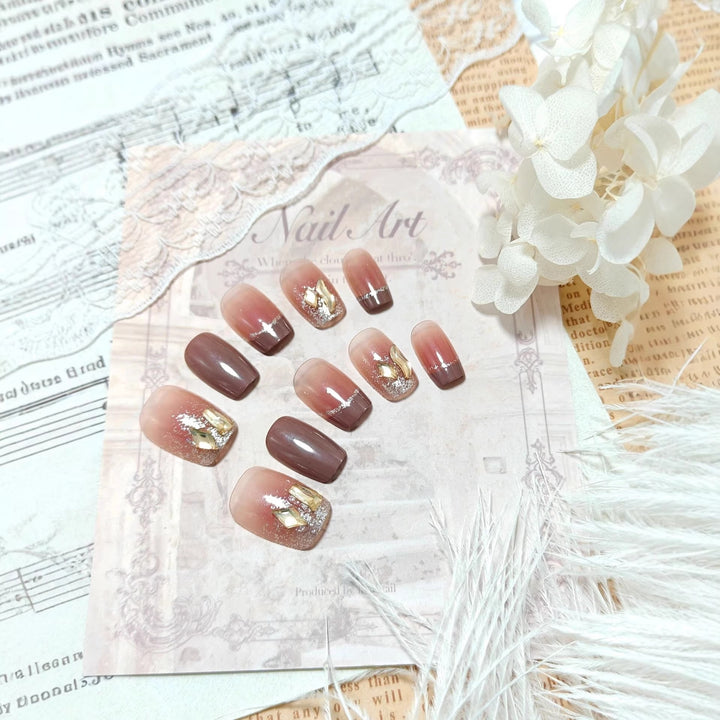 Acrylic nails in elegant ombre design with glitter elements Bowlift