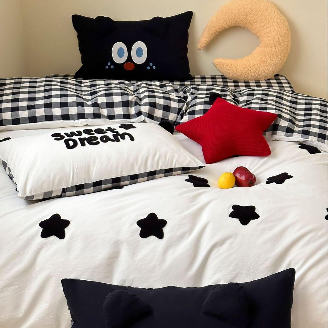 Children's bedding set with embroidered sprinkle appliqués, cuddle pillow and reversible function