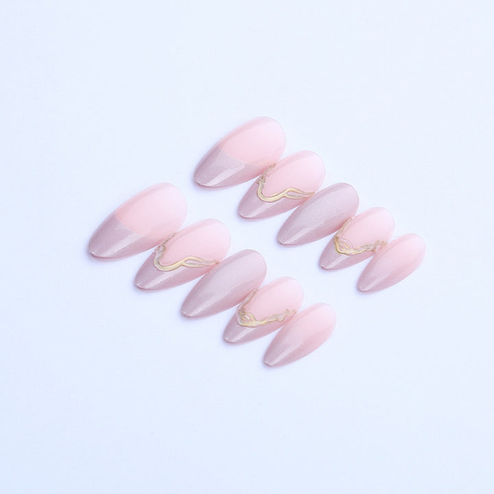Acrylic nail set with glamorous tips and golden accents Bowlift