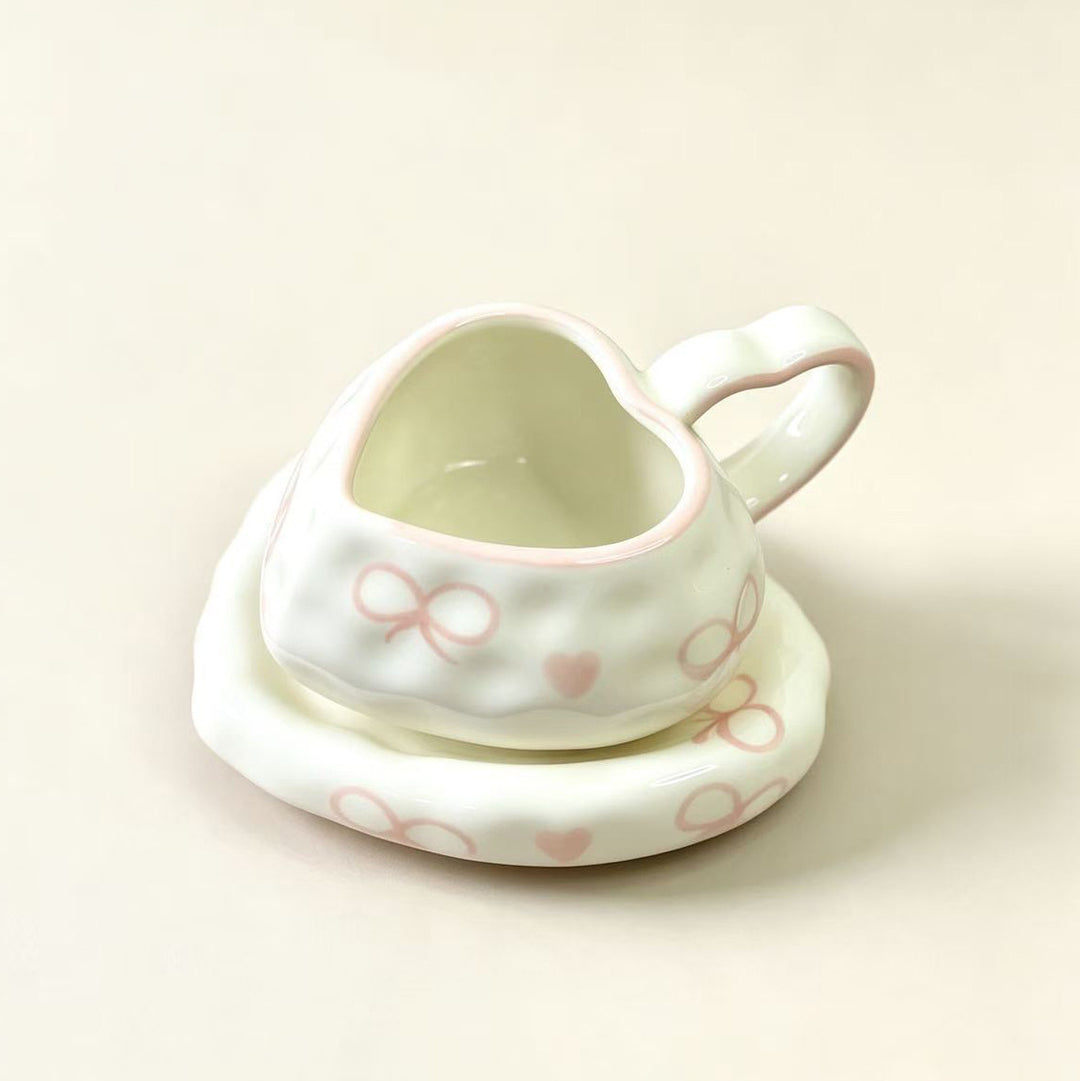 Heart-shaped ceramic cup set with saucer
