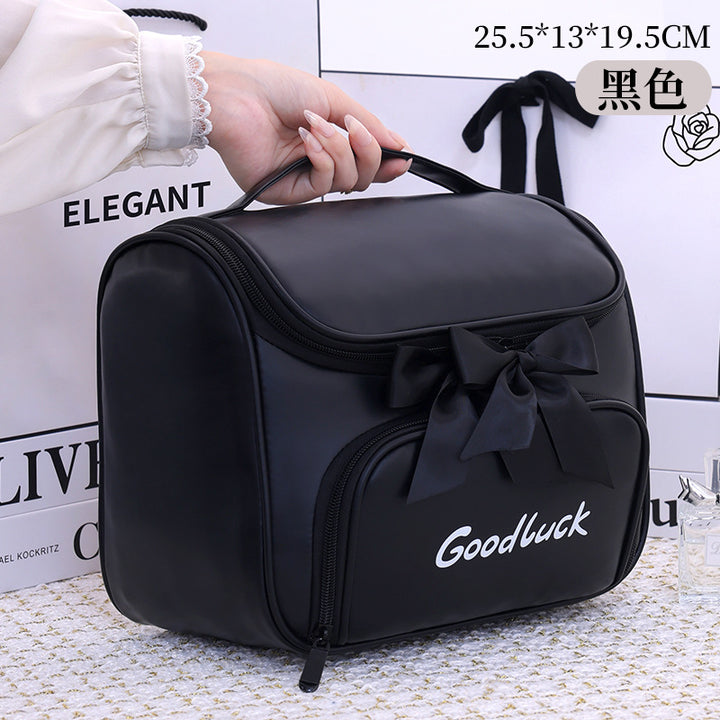 Cosmetic and toiletry bag with elegant bow accent Bowlift