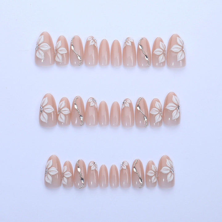 Artificial nail set with elegant flower designs and shimmering accents Bowlift