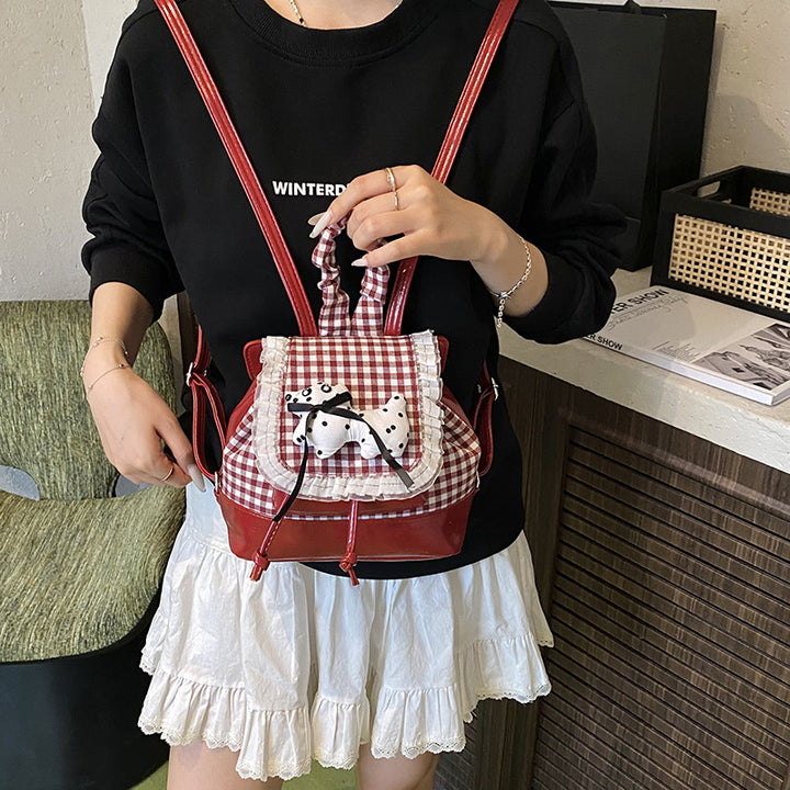 Playful backpack with checkered pattern and animal appliqué Bowlift
