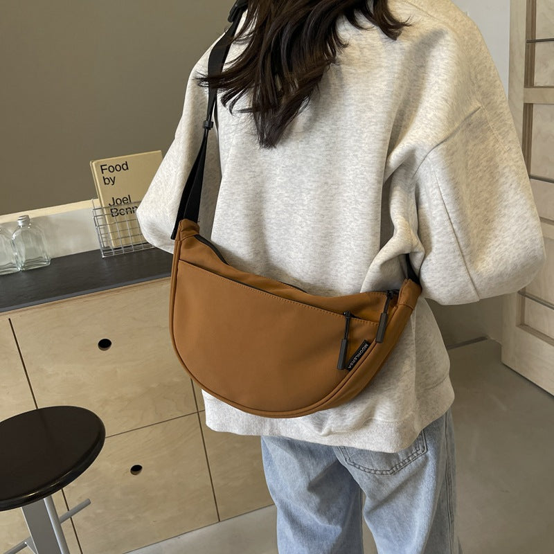 Shoulder bag with adjustable strap and multiple compartments Bowlift
