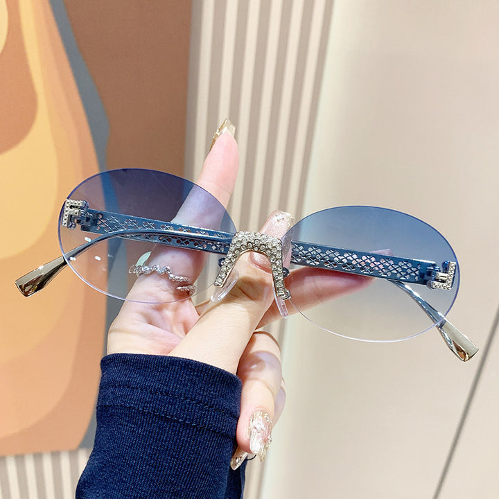 Women's sunglasses with glittering frame and oval lenses Bowlift