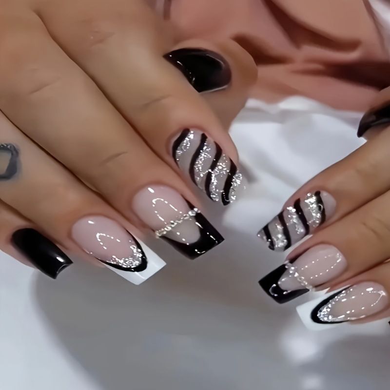 Elegant artificial nails with glitter and stripe accents Bowlift