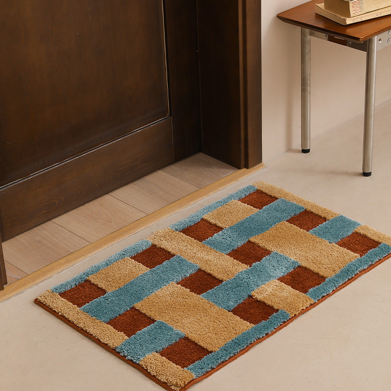 Rectangular tufted door mat with geometric block pattern and non-slip backing Bowlift