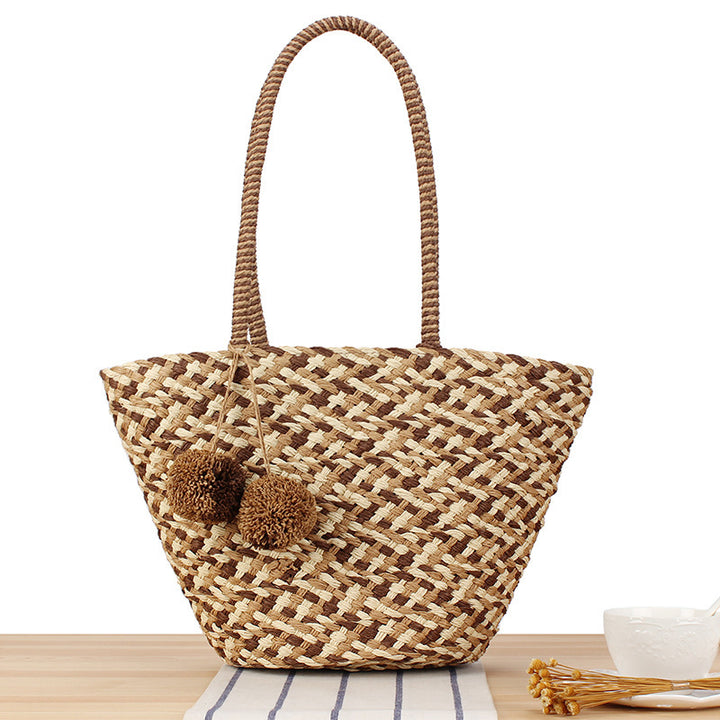Summer wicker handbag with pom poms Bowlift