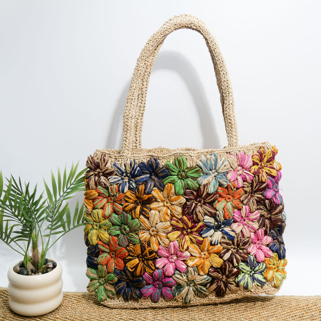 Handcrafted straw bag with floral appliqués Bowlift