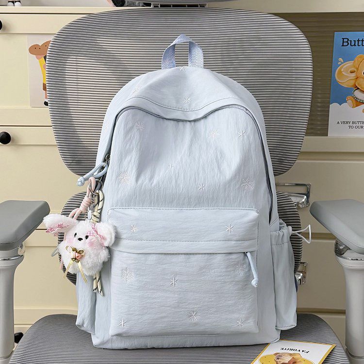 Playful backpack with fine embroidery Bowlift