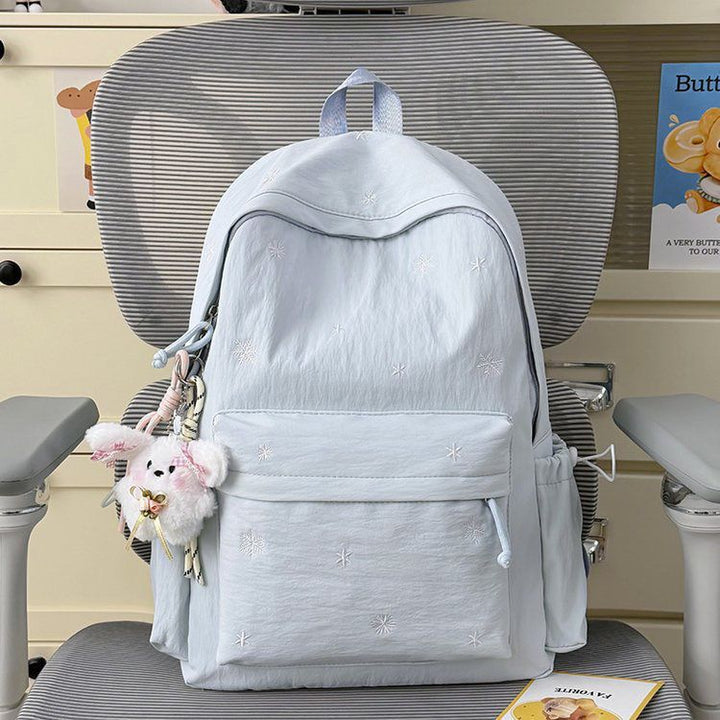Playful backpack with fine embroidery Bowlift