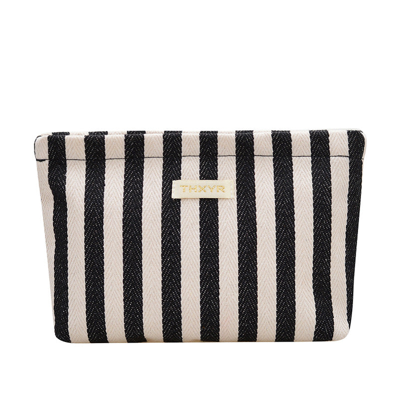 Striped canvas zippered cosmetic pouch clutch with padded lining and wristlet Bowlift