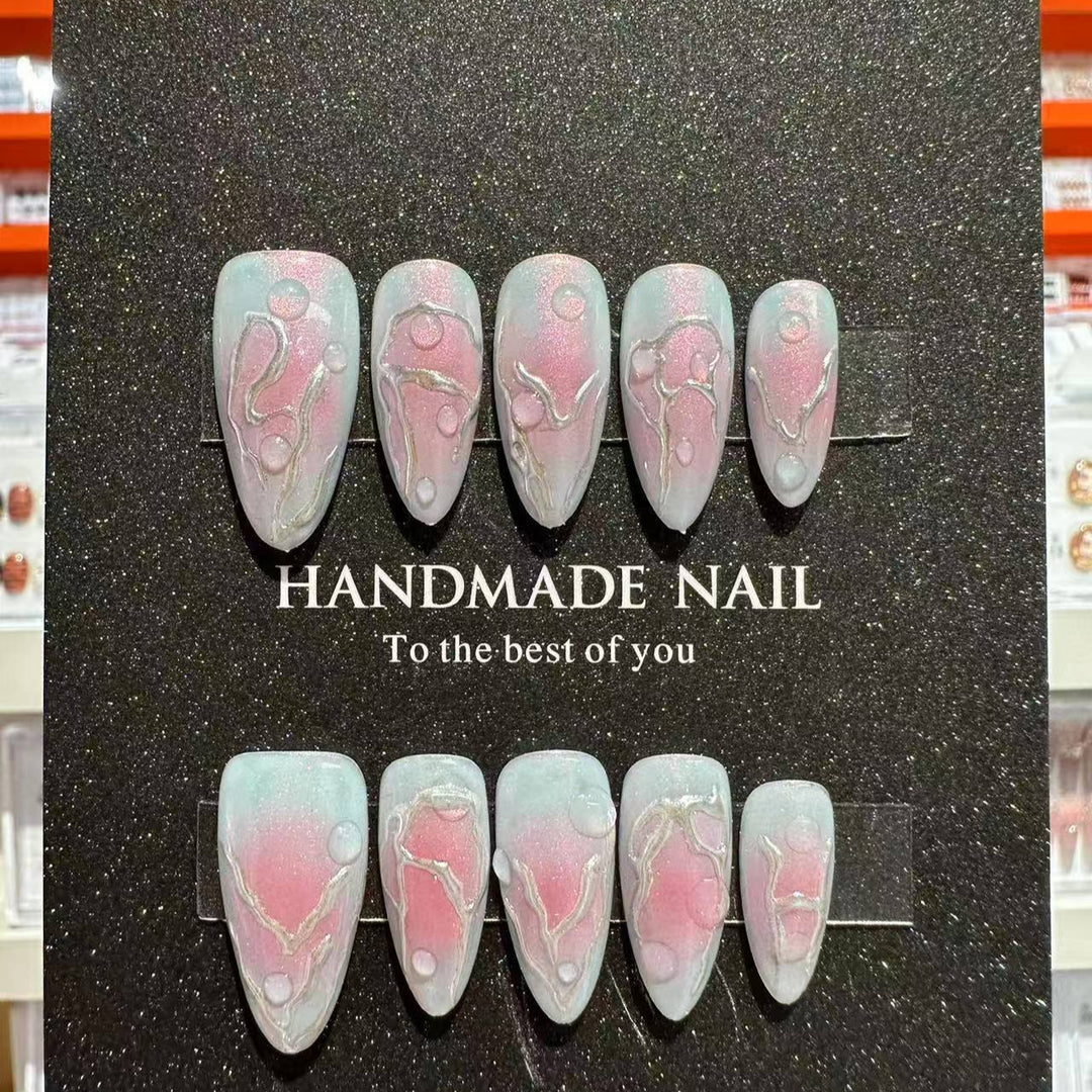 Artistic Press-On Nail Art Set with Charming Metallic Designs