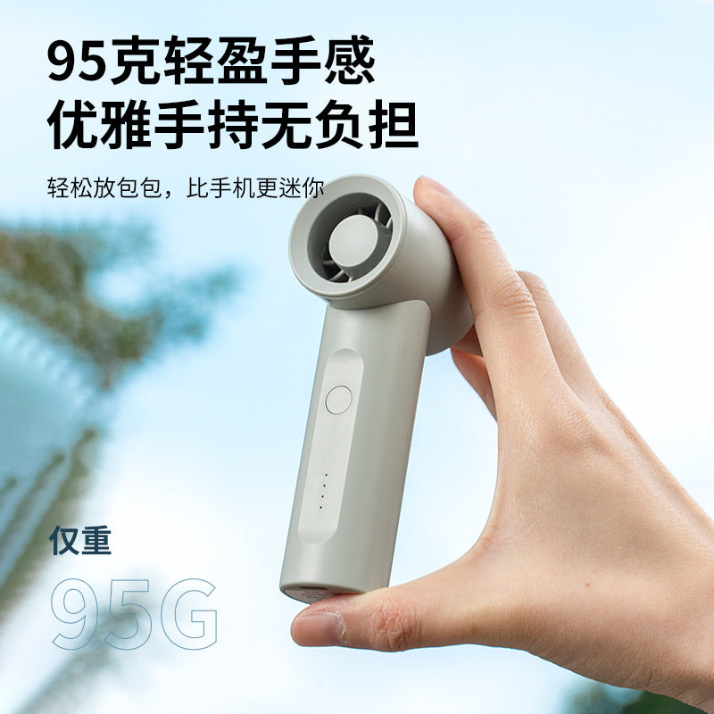 Women's portable handheld fan with ergonomic design and integrated USB charging station Bowlift