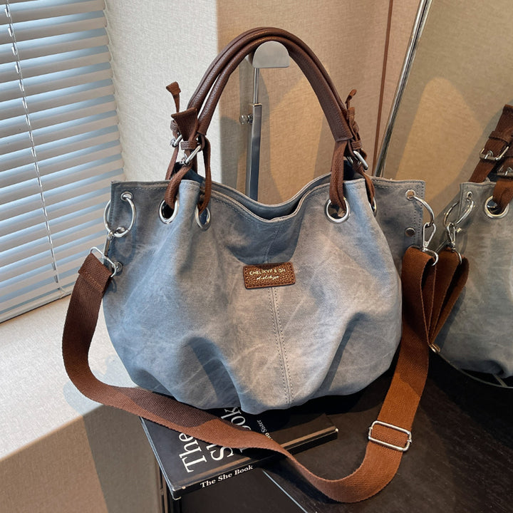 Everyday handbag with innovative carrying system Bowlift