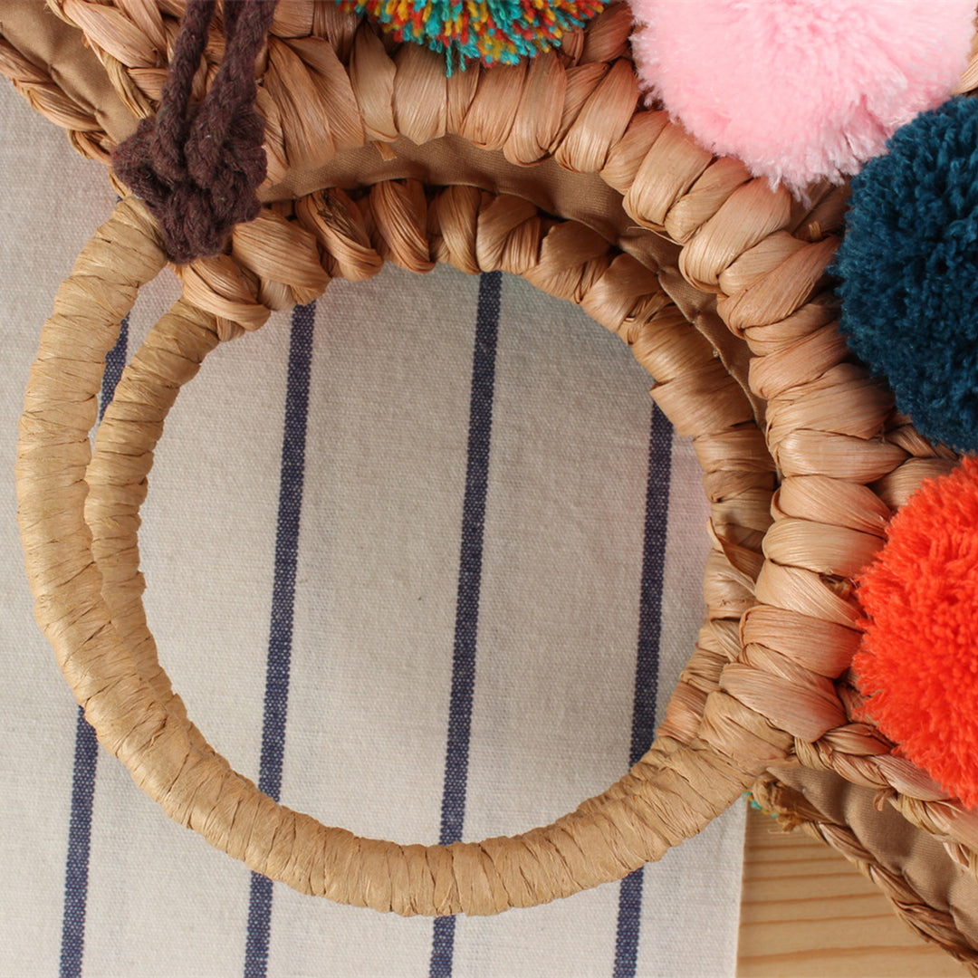 Basket bag with colorful pompons and carrying straps Bowlift