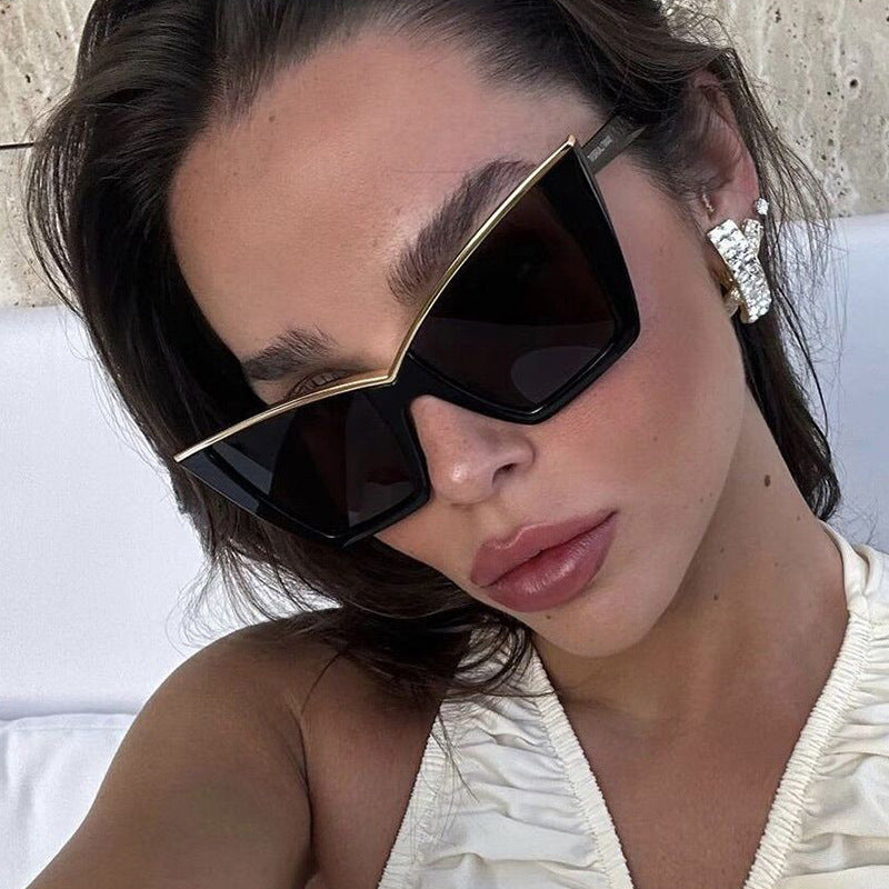 Women extravagant sunglasses with unique design and golden accents Bowlift