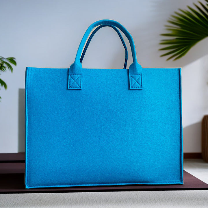 Structured felt tote bag with reinforced handles and organized interior Bowlift