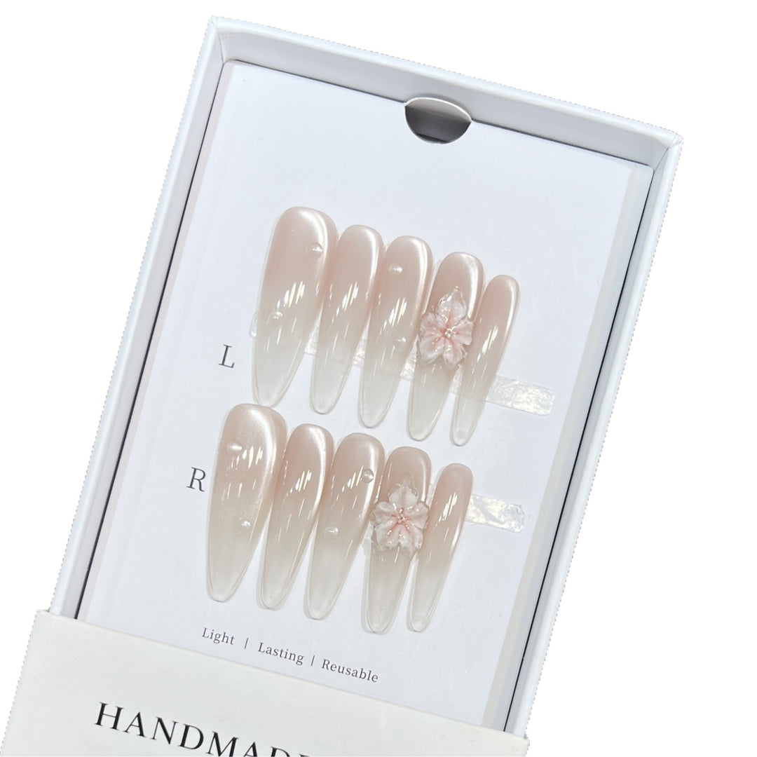 Elegant Stiletto Nail Extensions with Floral Accents Bowlift