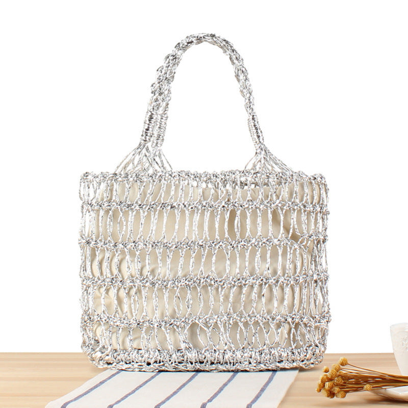 Shoulder bag made of punched metal grid Bowlift