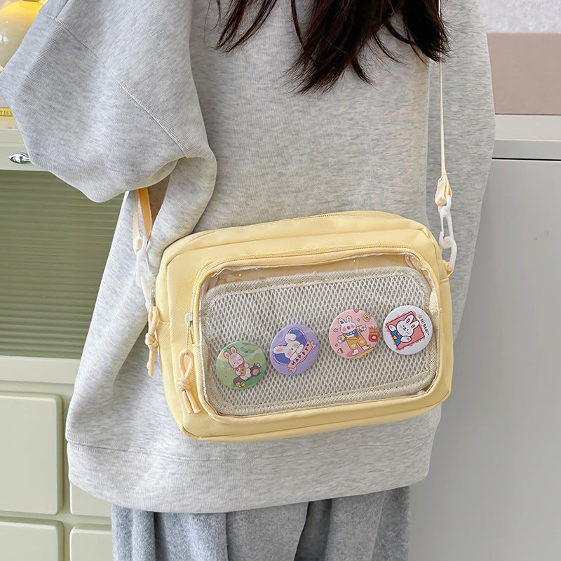 Shoulder bag with transparent viewing pocket and playful graphic design Bowlift