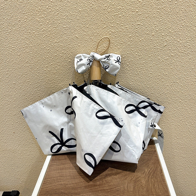 Women's foldable umbrella with elegant bow design Bowlift