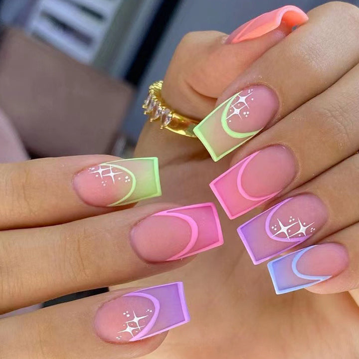 Acrylic nail set with colorful geometric designs and glitter accents Bowlift