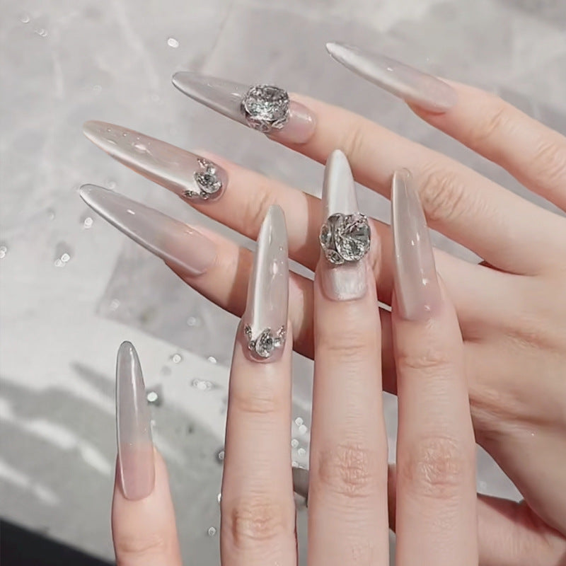 Acrylic nail set with glitter design and elegant 3D applications Bowlift