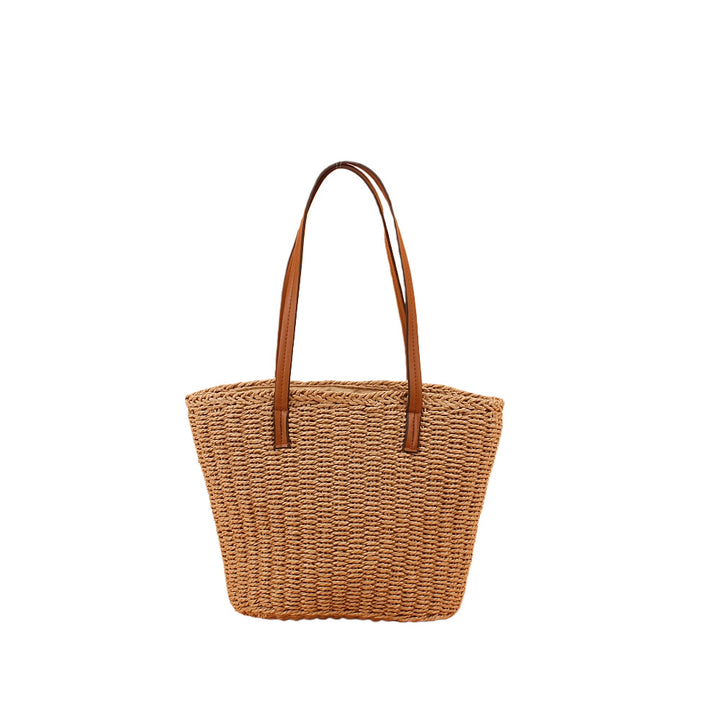 Handbag made of hand-woven natural material with sturdy leather handles Bowlift