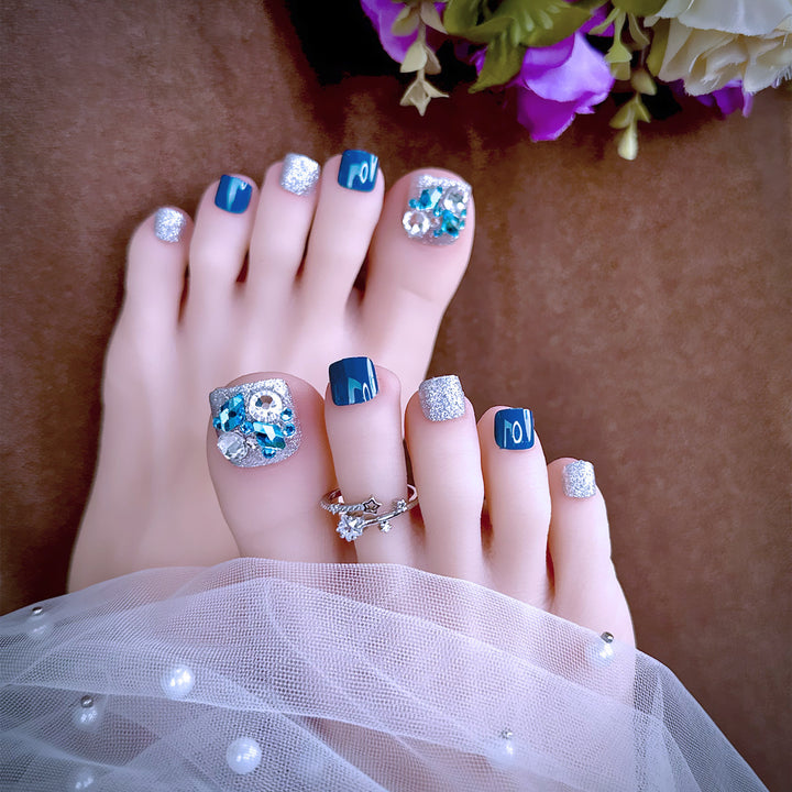 Artful toenail art with glitter and stone appliqués Bowlift