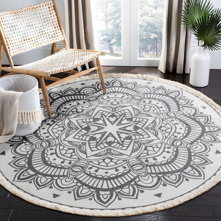 Round woven rug with mandala motif, flat cotton-jute mix and fringes Bowlift