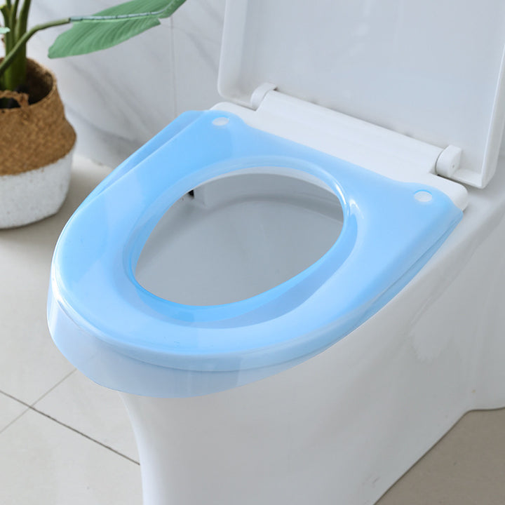 Padded toilet seat reducer with non-slip grips Bowlift