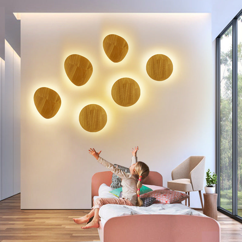 Organic pebble-shaped LED wall sconce solid wood face warm ambient backlight Bowlift