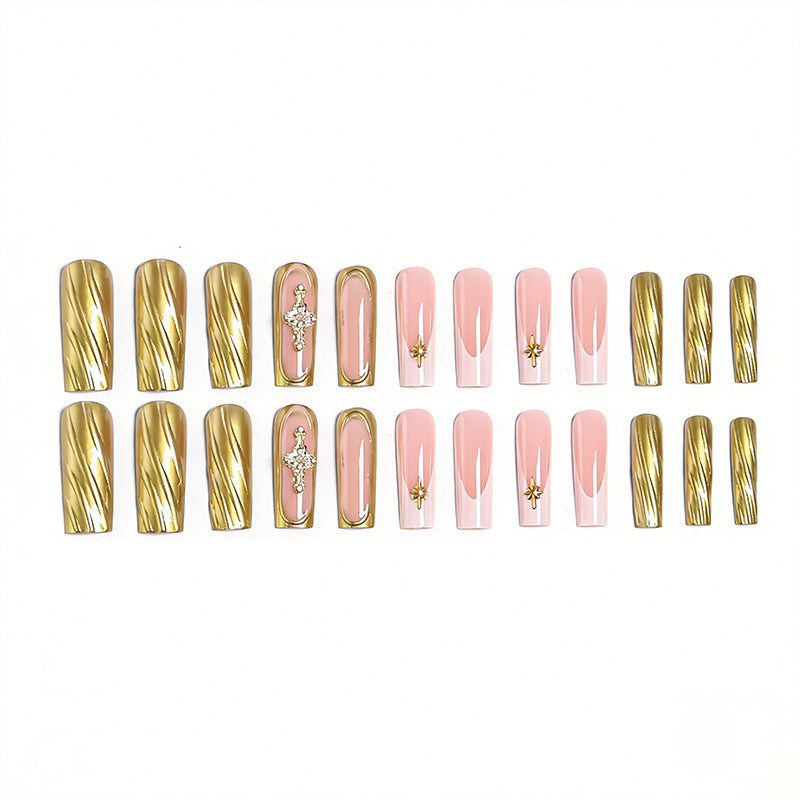 Acrylic nail set with elegant golden embellishments and glamorous accents Bowlift