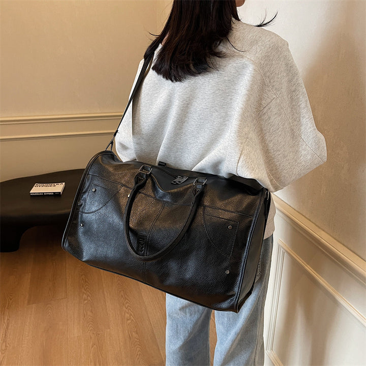 Elegant leather bag with stylish design and versatile carrying options Bowlift