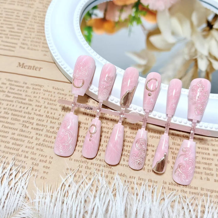 Artificial nails with elegant gold embellishments Bowlift