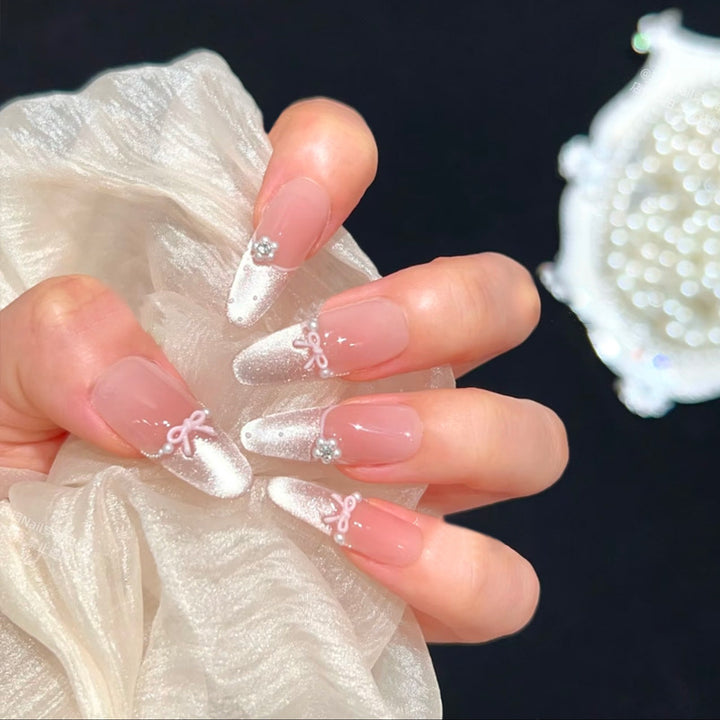 Artificial nail set with elegant bow and rhinestone embellishments Bowlift