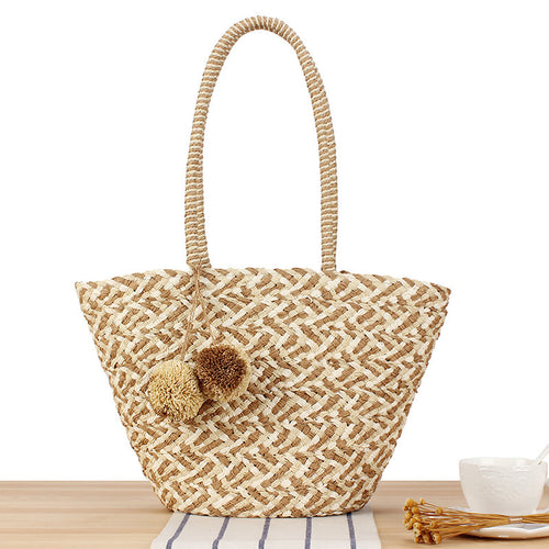 Summer wicker handbag with pom poms Bowlift