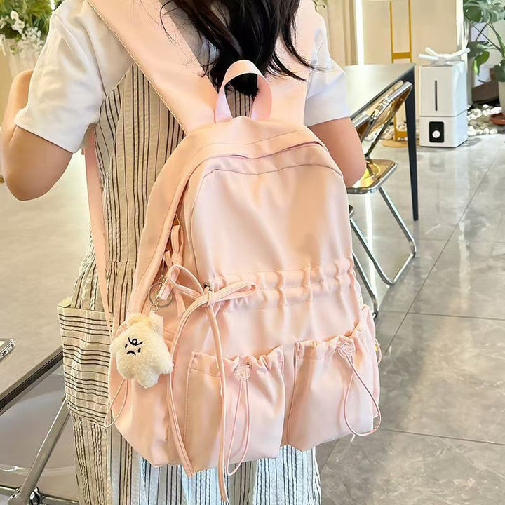 City backpack with innovative compartment system and adjustable carrying straps Bowlift