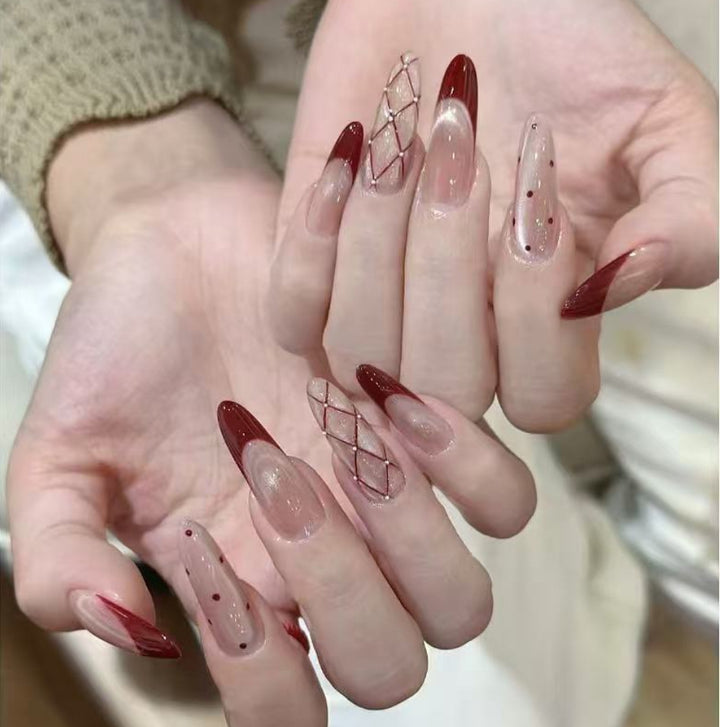 Elegant Stiletto Nail Set with Intricate Designs Bowlift