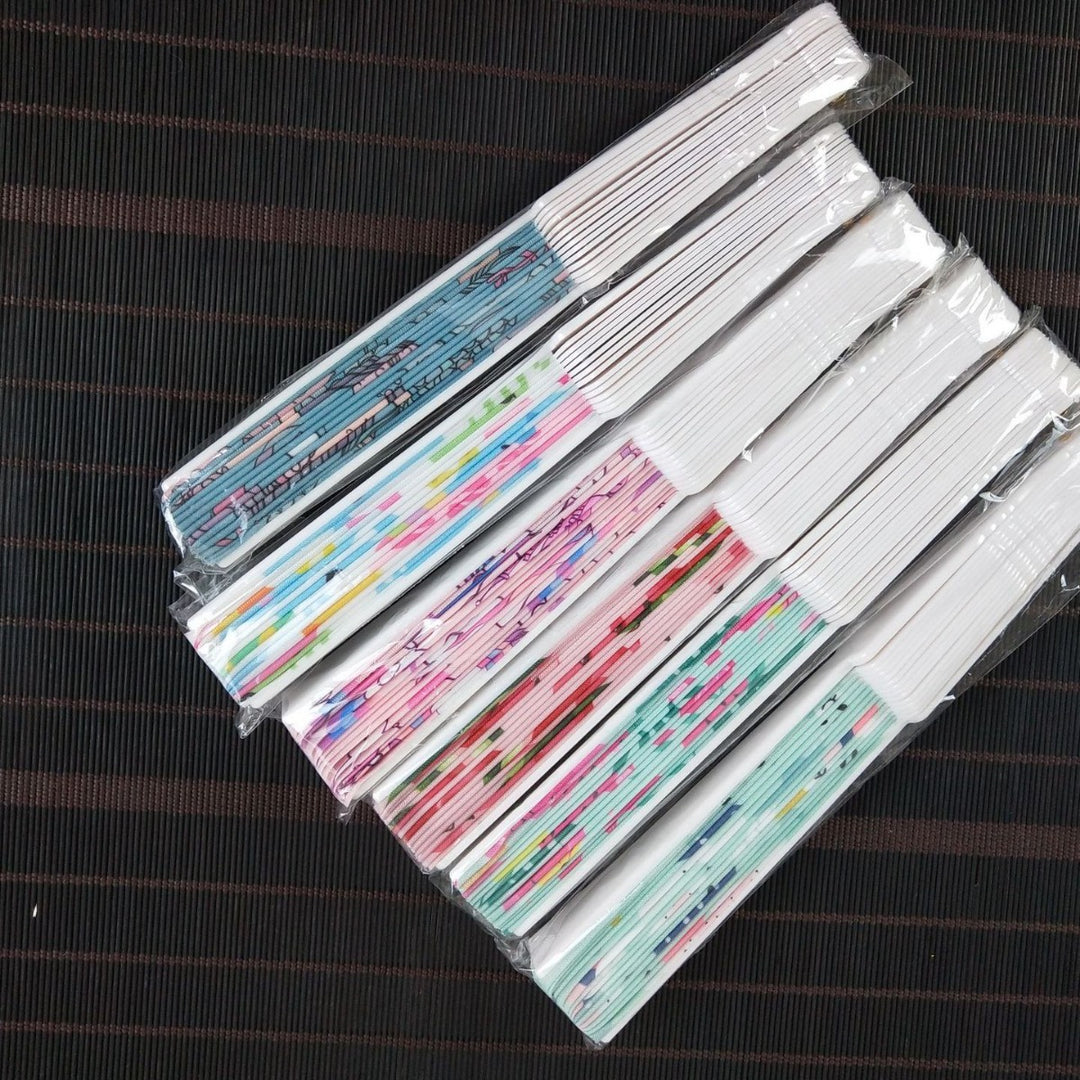 Women folding hand fan with shimmering scale pattern Bowlift
