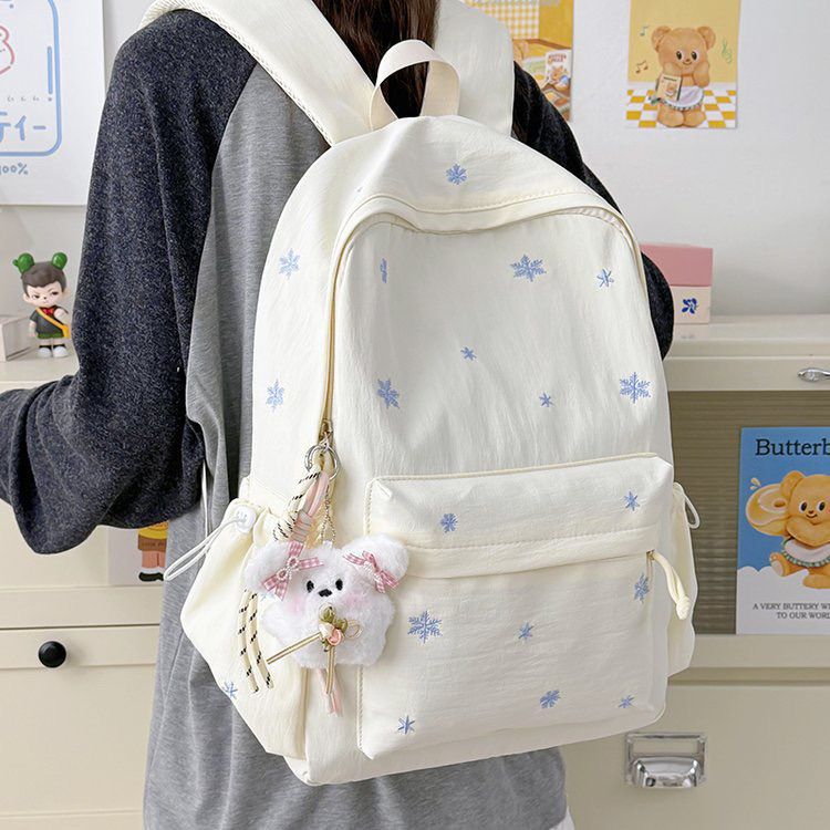 Playful backpack with fine embroidery Bowlift